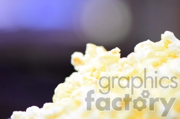 A close-up image of freshly popped popcorn with a blurred background.