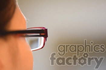 Close-Up of Red Rectangular Glasses on Person's Face