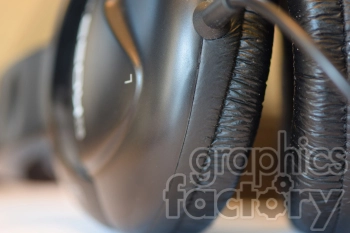 Close-up image of over-ear headphones showing the ear cups and a part of the headband.