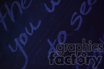 A close-up image of handwritten text on a dark background, illuminated by purple lighting.