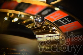 Close-up of a casino roulette wheel with a metallic ball landing on number 21.