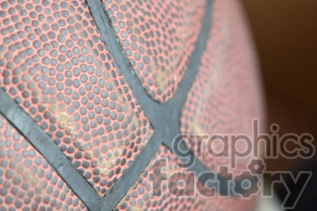 A close-up view of a textured basketball showing its detailed surface and grooves.