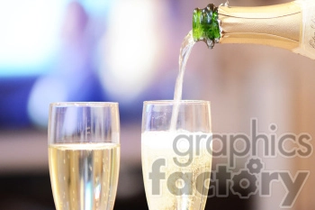 The clipart image shows a bottle of champagne being poured into two tall glasses.
