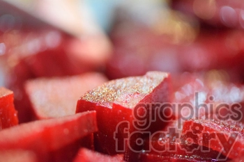 Close-up macro shot of diced red beets.