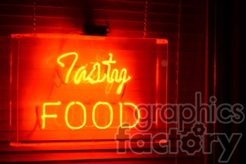 A vibrant neon sign reading 'Tasty FOOD' illuminated in bright red and yellow lights against a dark background.